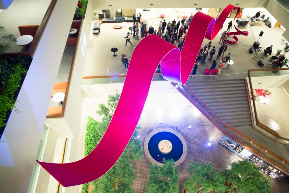 Unveil fabric ribbon suspended in the AIG Houston atrium